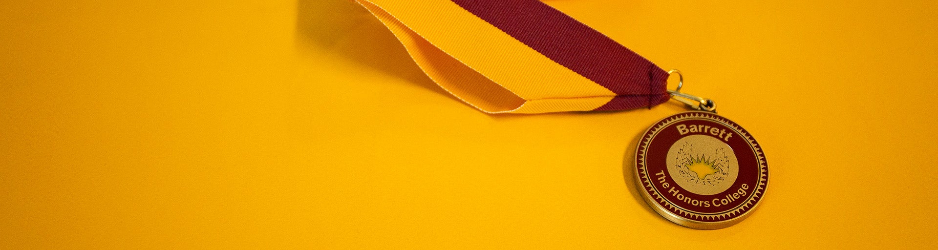 Barrett medallion over a gold background